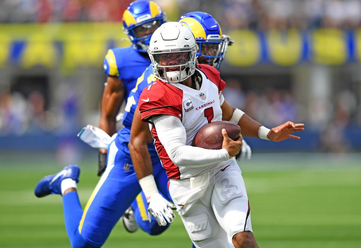 Arizona Cardinals quarterback Kyler Murray scrambles against the Rams.