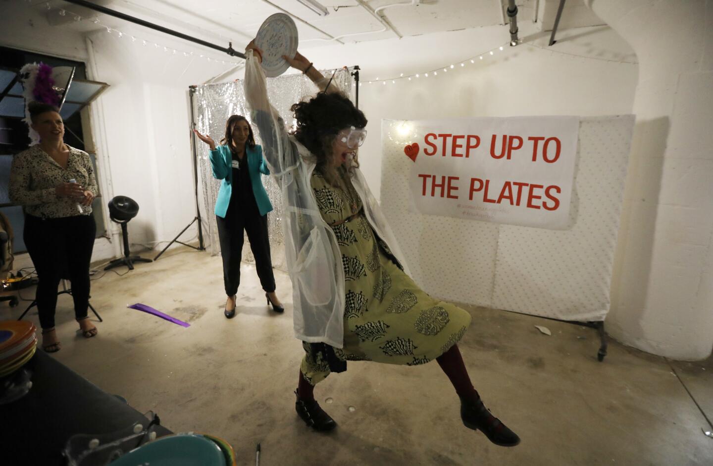 Alexis Garcia, 22, of Downey breaks plates in L.A. on Jan. 12 . Women Breaking Plates is a "women's healing and empowerment movement." Participants throw dishes against a brick wall as a cathartic way of shattering their inner demons, breaking free of self-doubt and breaking through the limitations and expectations that society places on women. There is also drumming, dancing, punching and, hopefully, healing throughout the evening.