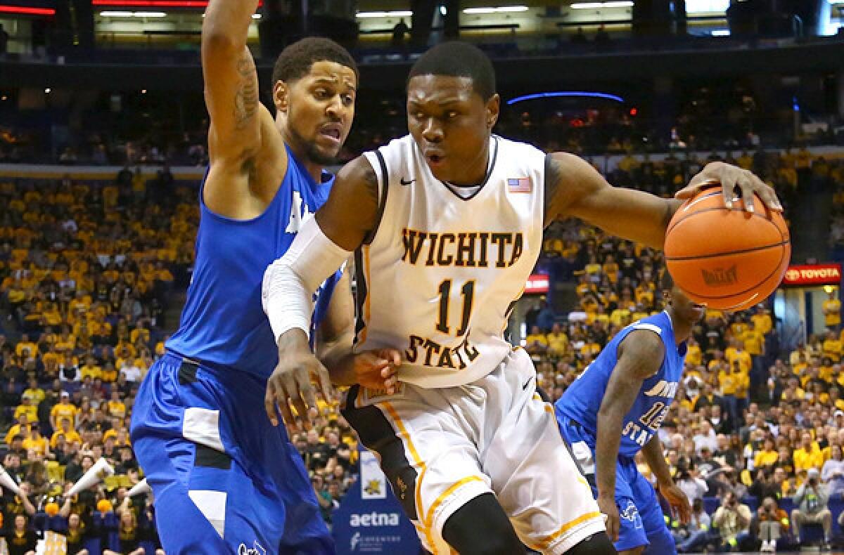 Wichita State's Cleanthony Early tries to drive past Indiana State's Khristian Smith during the Missouri Valley Conference tournament championship game on Sunday in St. Louis.