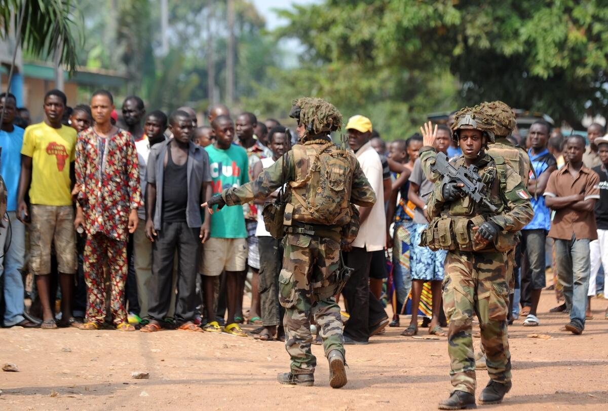 Troops conduct a disarmament operation Monday in Bangui, the capital of the Central African Republic.