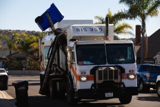 Refuse packers collect recycling on a route in South Bay San Diego on Friday, Nov. 25, 2022