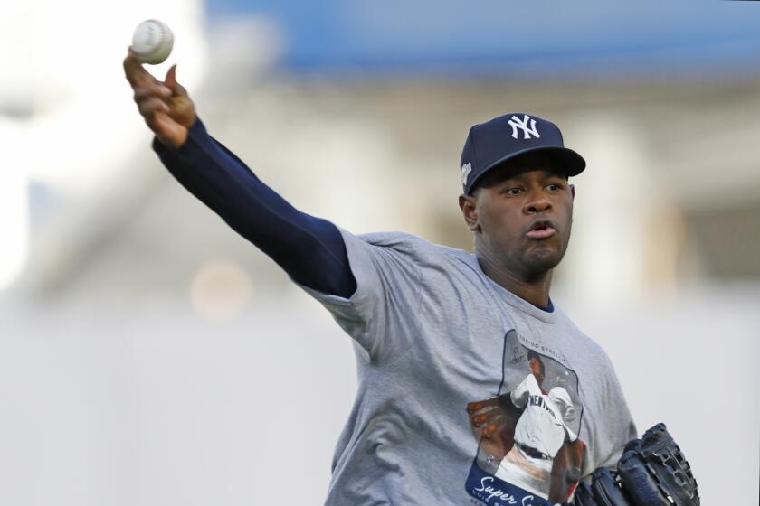 New York Yankees starting pitcher Luis Severino practices on flat ground, Monday, Oct. 14, 2019, at Yankee Stadium in New York, on an off day during the American League Championship Series between the New York Yankees and the Houston Astros. (AP Photo/Kathy Willens)
