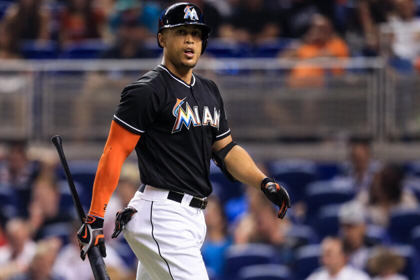 Miami Marlins' Giancarlo Stanton reacts after striking out to end the fifth inning against the Washington Nationals on Saturday.