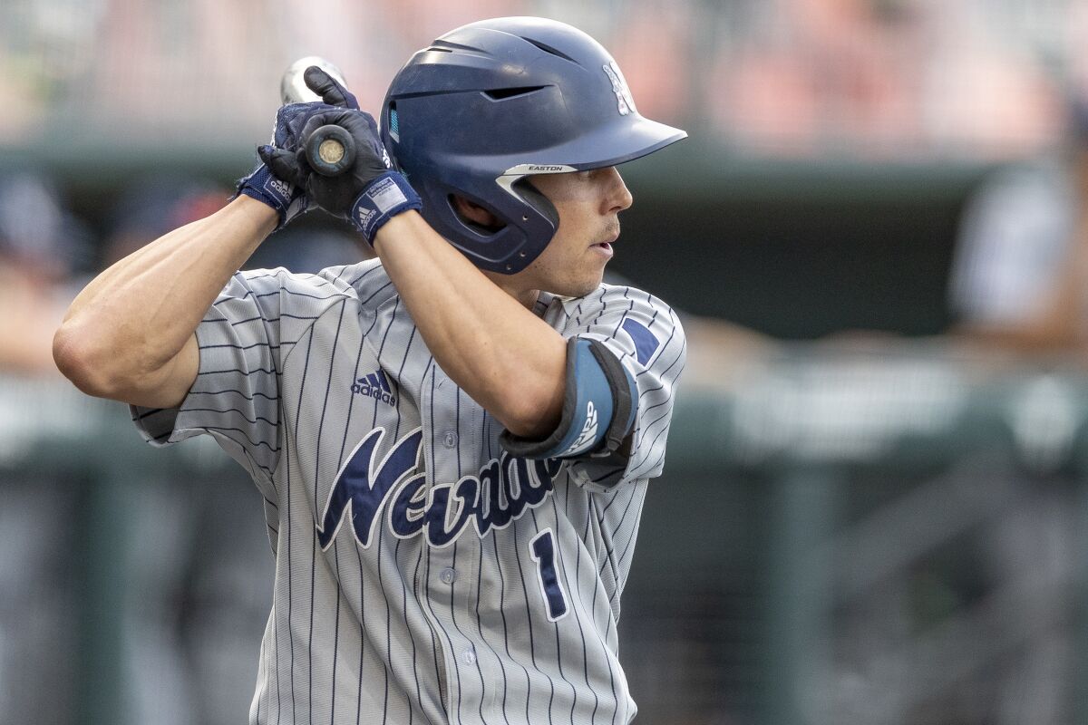 FILE - Nevada's Tyler Bosetti goes to bat against Texas during an NCAA college baseball game in Austin, Texas, in this Tuesday, April 13, 2021, file photo. Bosetti has set an NCAA Division I record with home runs in nine consecutive games. Bosetti homered to right-center field in his first at-bat Tuesday, May 11, 2021, against Arizona to break the old record. (AP Photo/Stephen Spillman, File)