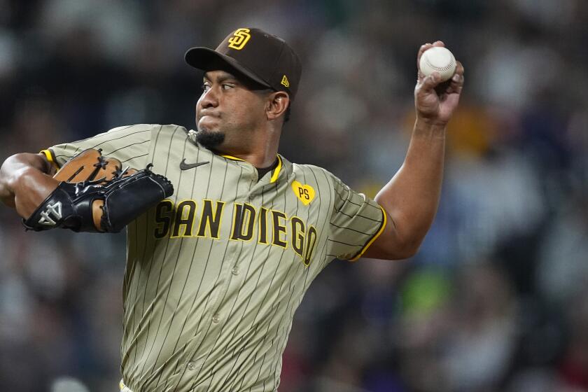 San Diego Padres relief pitcher Wandy Peralta works against the Colorado Rockies in the eighth inning of a baseball game, Wednesday, April 24, 2024, in Denver. (AP Photo/David Zalubowski)