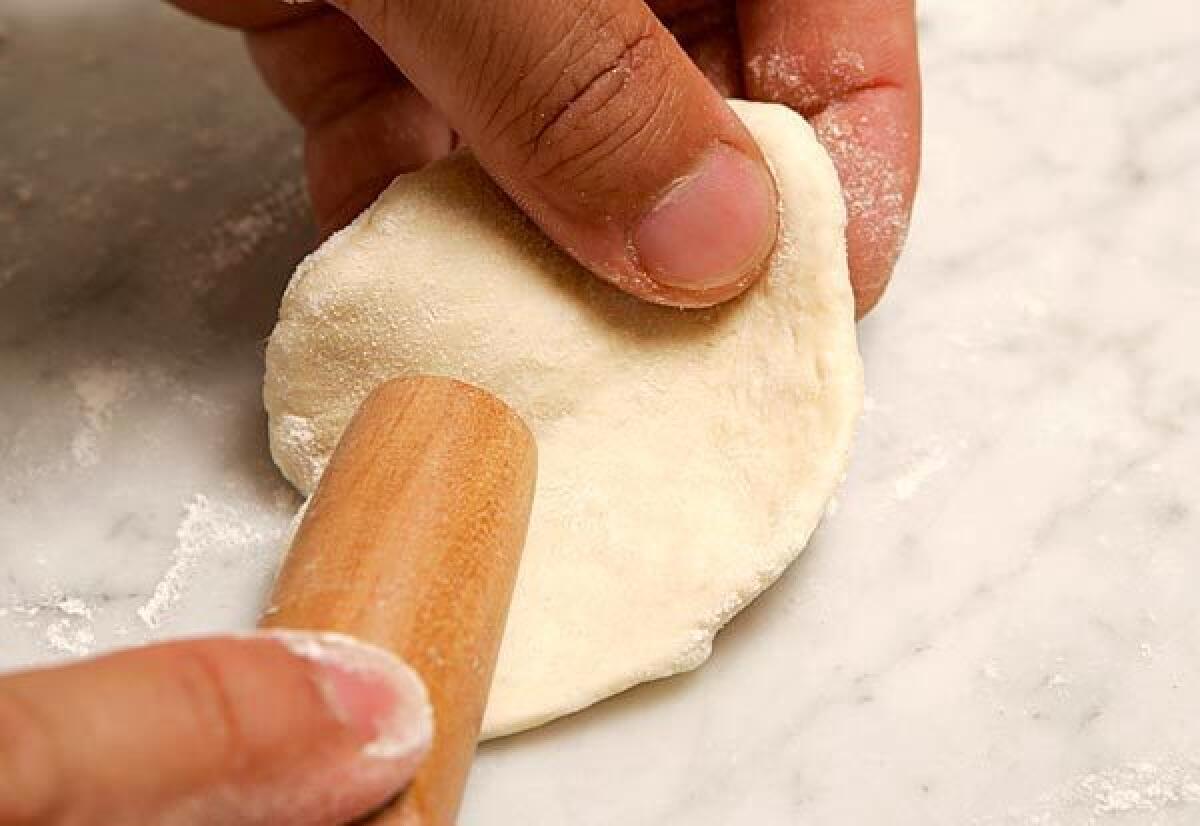 An Asian-style rolling pin will help you shape the dough.