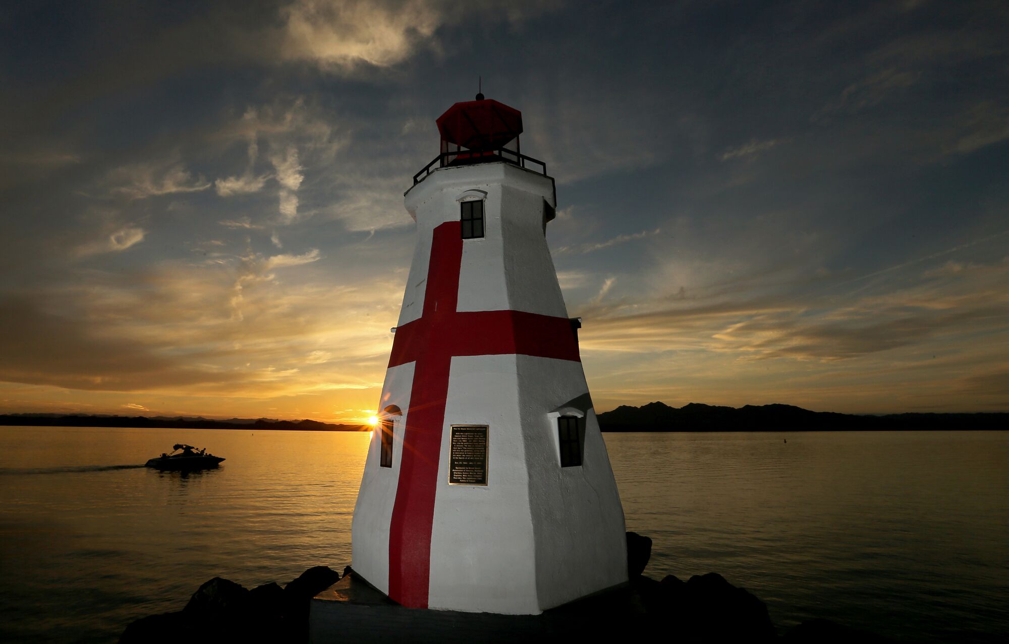 A replica of the Harbor Head Lighthouse in New Brunswick stands at the edge of Lake Havasu. 