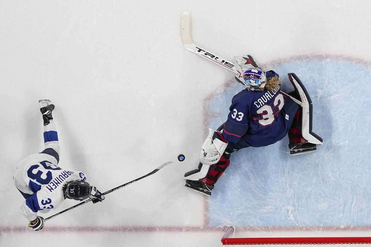 U.S. goaltender Alex Cavallini makes a kick save on a shot by Finland's Michelle Karvinen on Monday.