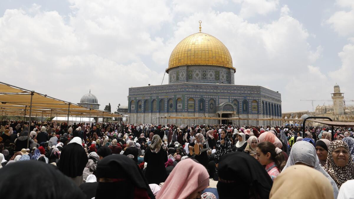 Palestinian worshippers pray at the Dome of the Rock in Jerusalem on the third Friday prayers of the Muslim holy month of Ramadan.