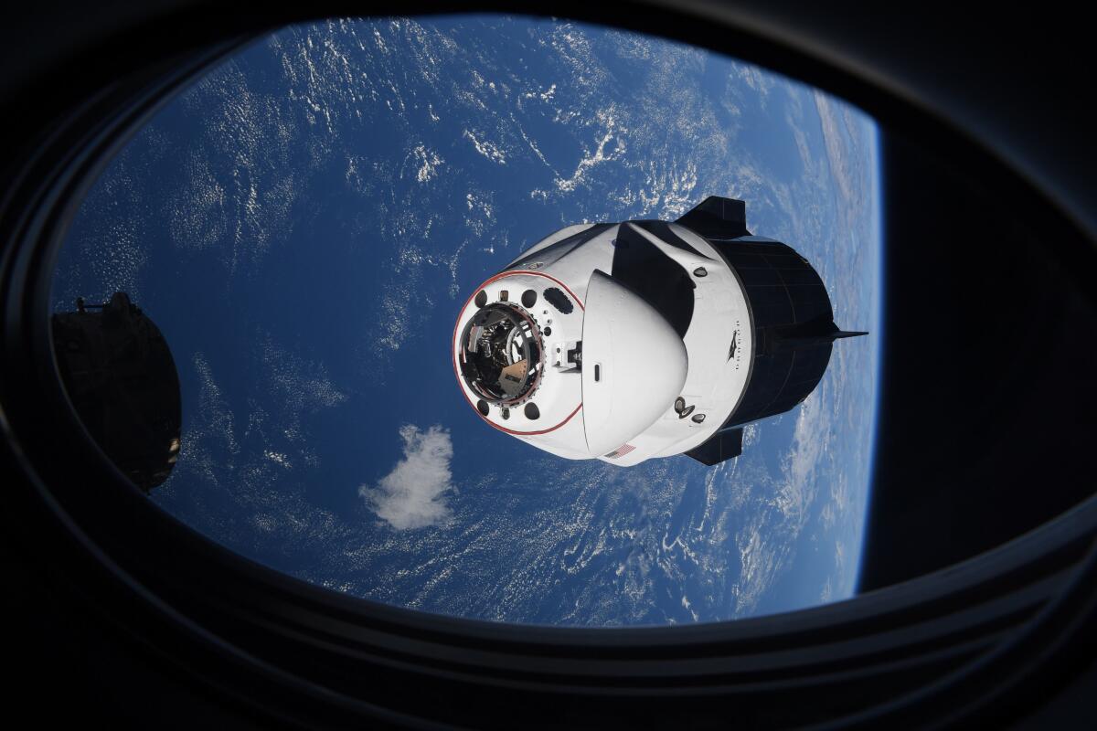 The SpaceX Crew Dragon capsule approaches the International Space Station.