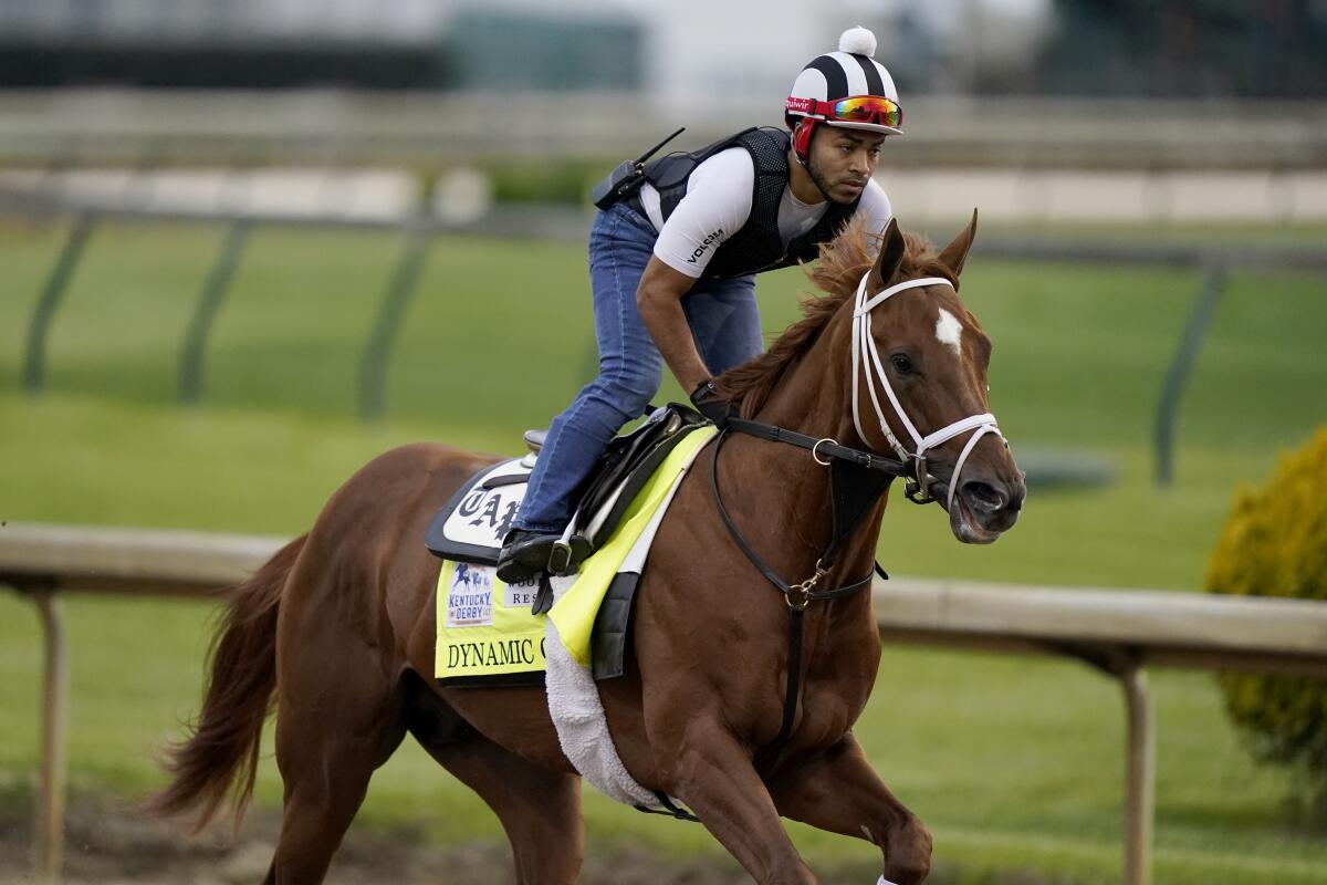 Dynamic One works out at Churchill Downs on Wednesday.