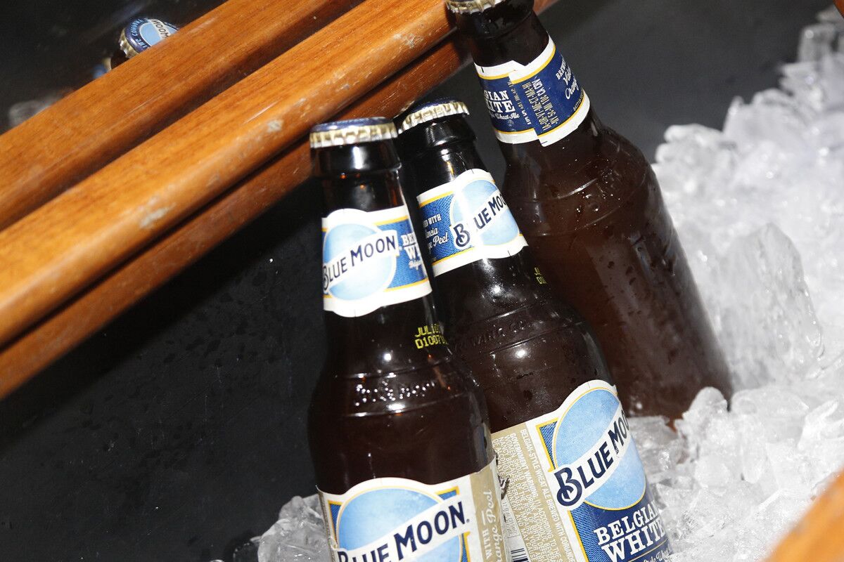 The blind-daters were chauffeured in a limo stocked with Blue Moon Belgian White. (David Brooks / Union-Tribune)