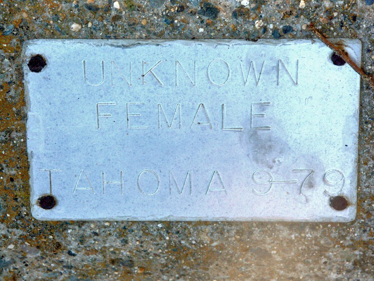 A plaque reading "Unknown Female"