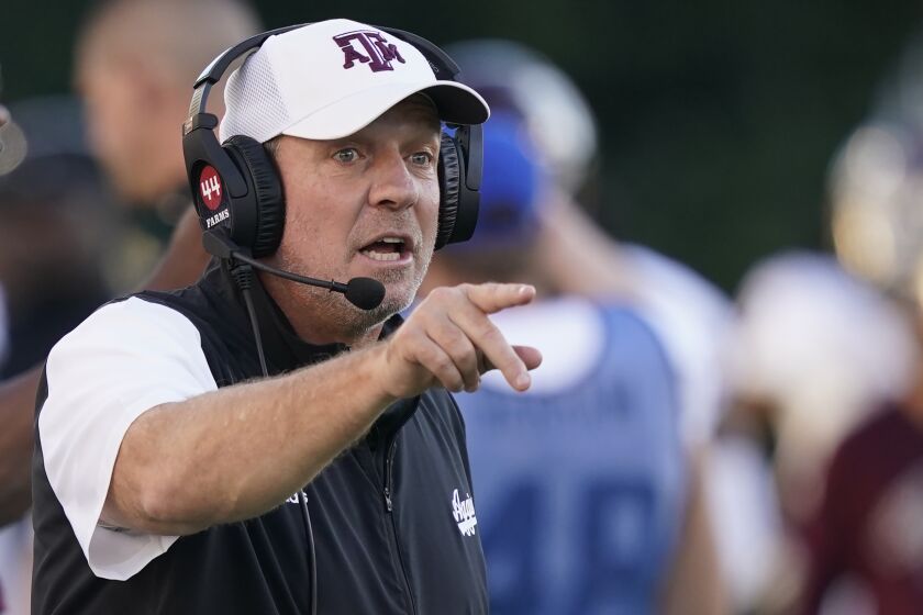 Texas A&M head coach Jimbo Fisher calls out to his team during the second half of an NCAA college football game against Mississippi State in Starkville, Miss., Saturday, Oct. 1, 2022. (AP Photo/Rogelio V. Solis)