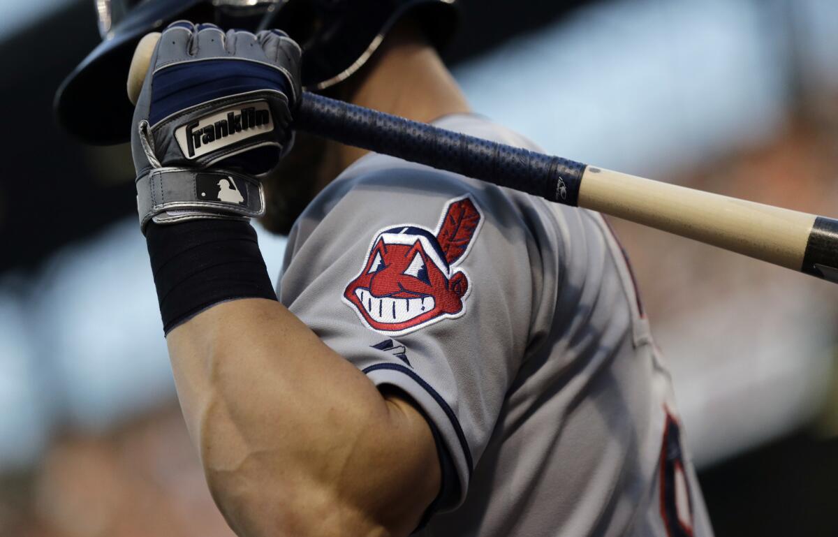 FILE - This June 26, 2015, file photo, shows the Cleveland Indians logo on a jersey during a baseball game against the Baltimore Orioles in Baltimore. Indians are taking the divisive Chief Wahoo logo off their uniforms and caps, starting in 2019.