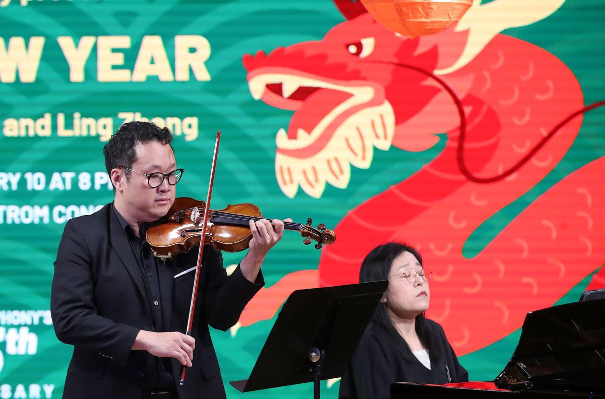  Dennis Kim and Jin Kyung perform some of the music from the Lunar New Year concert.