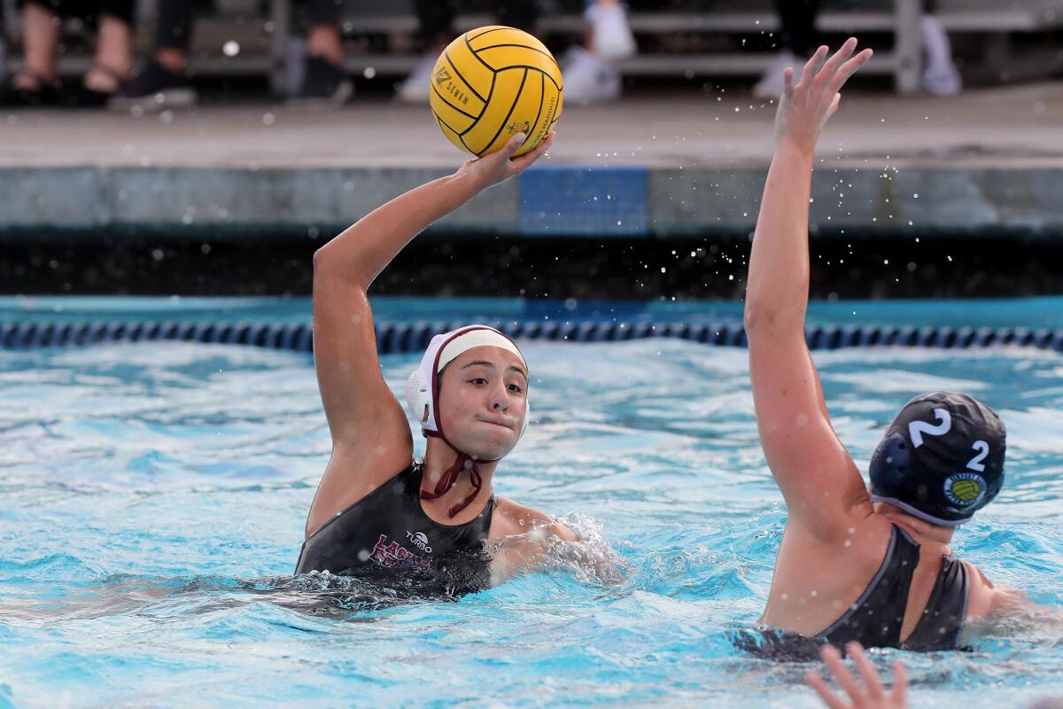 Laguna Beach's Jordan Schneider, left, competes against Newport Harbor's Harper Price during the second half Wednesday. 