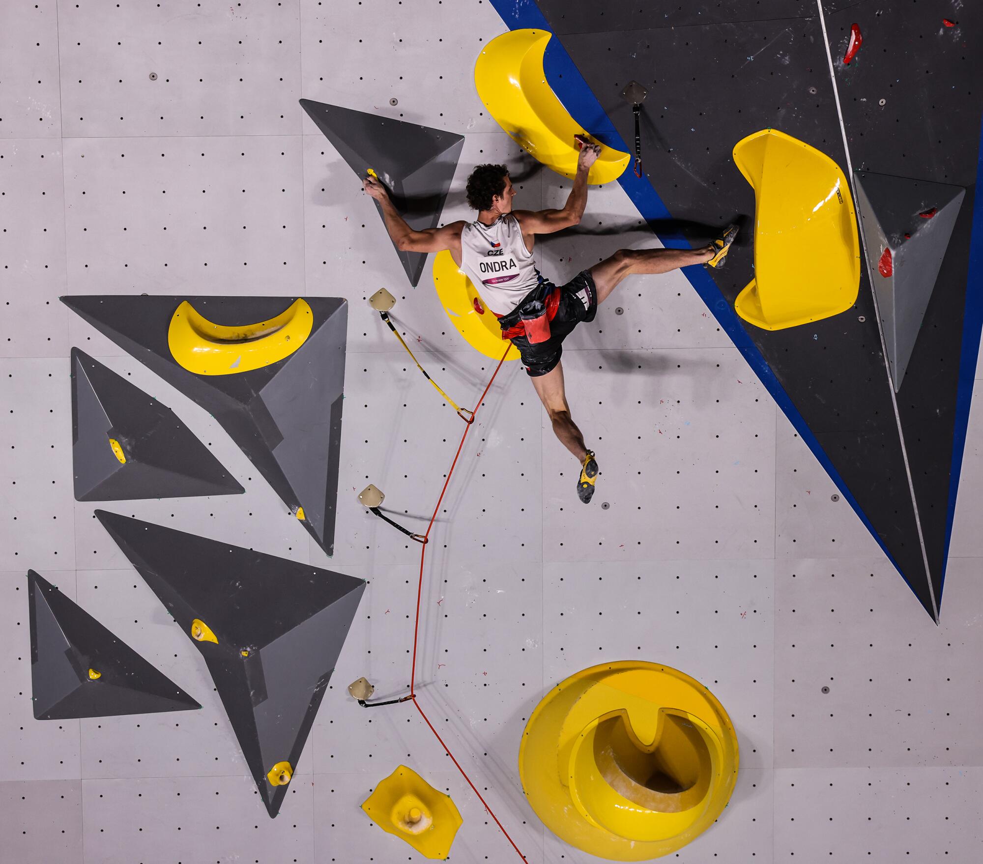 Adam Ondra scales the sport climbing wall at Aomi Urban Sports Park.