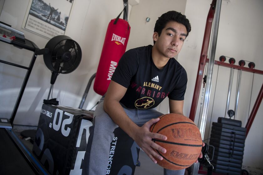 CASTAIC, CA - DECEMBER 30: Bishop Alemany High School guard Nico Ponce sits for a portrait at his home gym on Wednesday, Dec. 30, 2020 in Castaic, CA. (Brian van der Brug / Los Angeles Times)