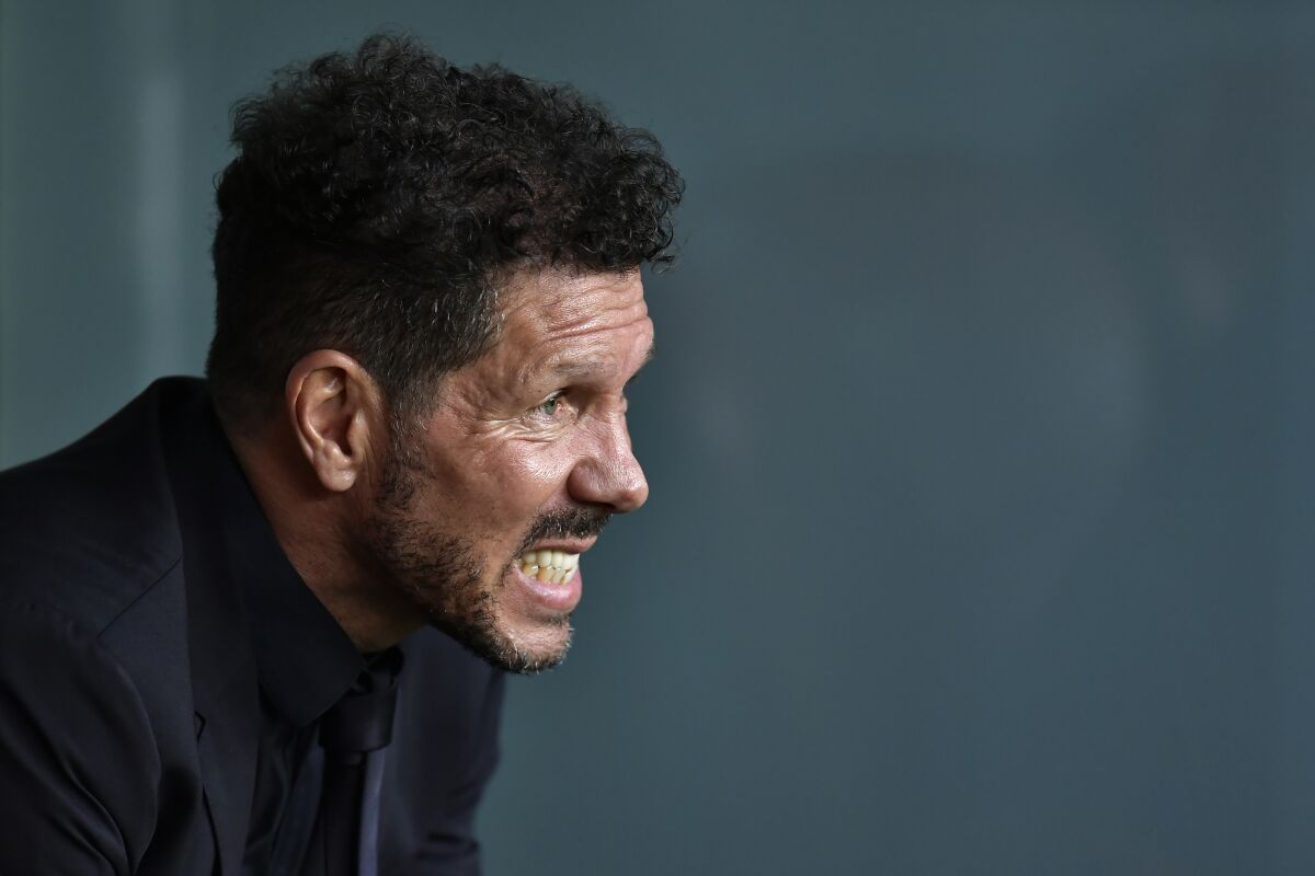Atletico Madrid's head coach Diego Simeone sits on the bench during a Spanish La Liga soccer match between Athletic Club Bilbao and Atletico Madrid at the San Mames stadium in Bilbao, Spain, Saturday, April 30, 2022. (AP Photo/Alvaro Barrientos)