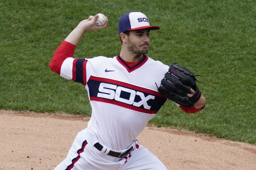 Chicago White Sox starting pitcher Dylan Cease throws against the Kansas City Royals during the first inning of a baseball game in Chicago, Sunday, April 11, 2021. (AP Photo/Nam Y. Huh)