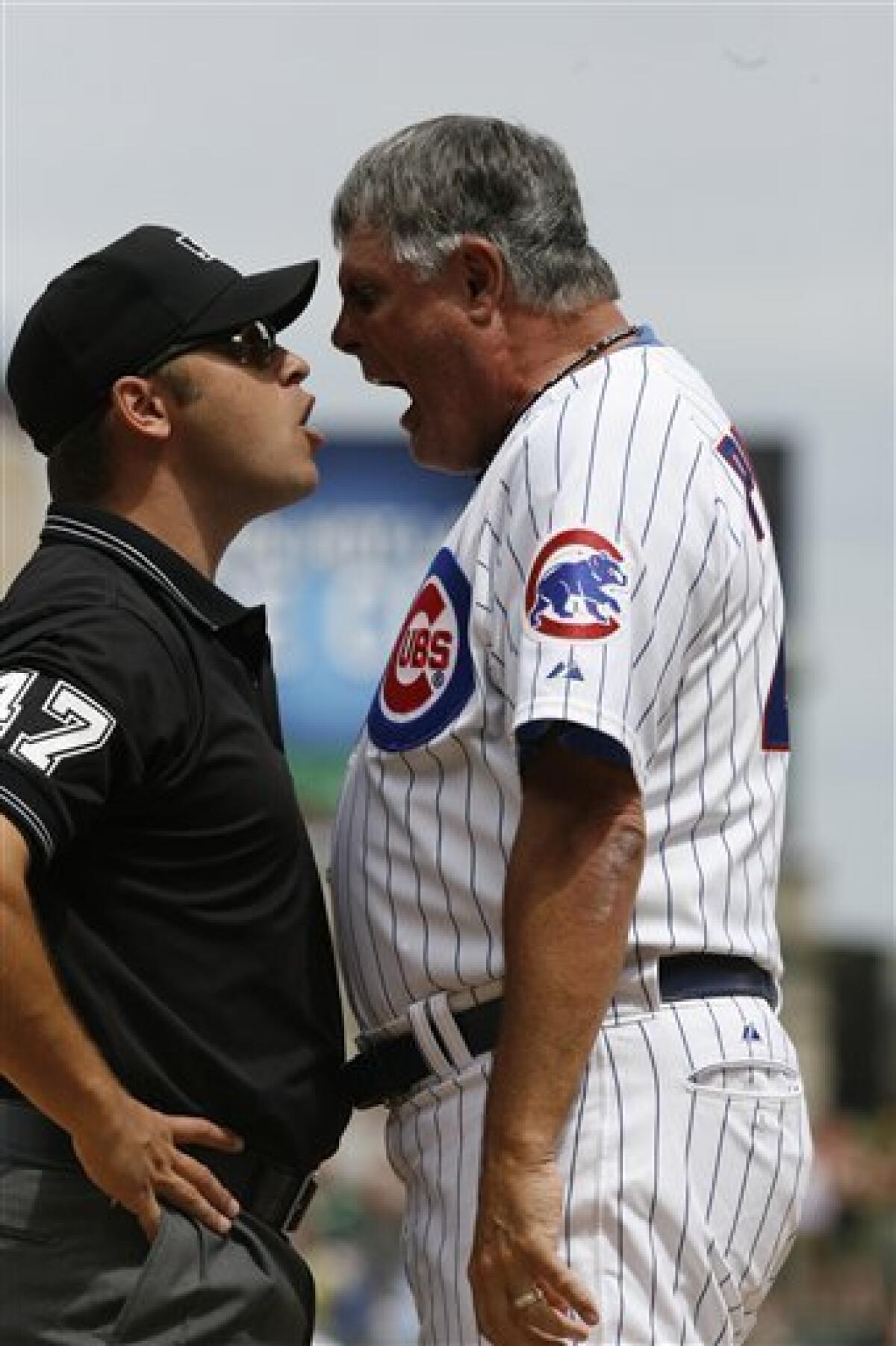 Chicago Cubs manager Lou Piniella walks the dugout during the