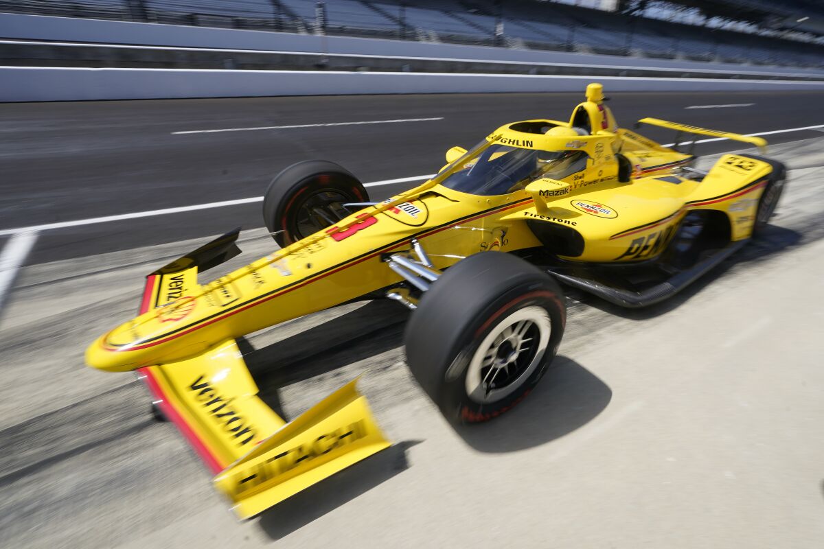 Scott McLaughlin, of New Zealand, pulls into the pits during testing at Indianapolis Motor Speedway, Thursday, April 21, 2022, in Indianapolis. (AP Photo/Darron Cummings)