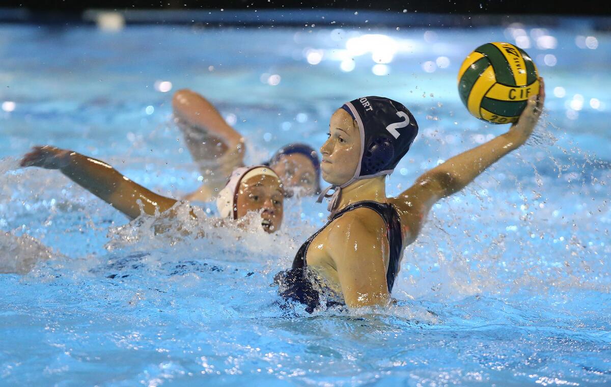 Newport Harbor’s Taylor Smith shoots and scores during the semifinals of the CIF Southern Section Division 1 playoffs against Laguna Beach at Irvine’s Woollett Aquatics Center on Wednesday.