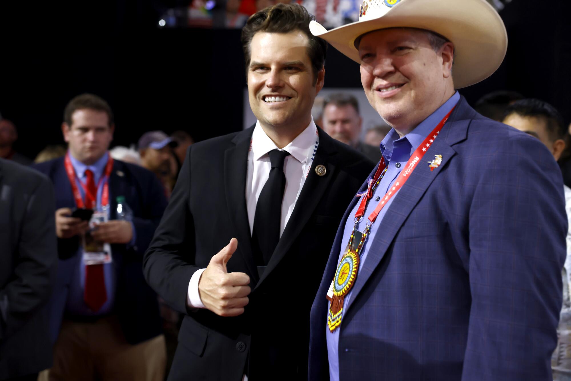 Florida Rep. Matt Gaetz, left, poses with a delegate at the 2024 Republican National Convention.