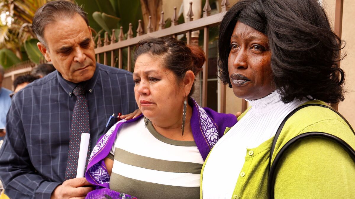 Margarita Cervacio, center, and Gwendolyn Posey are part of a group calling on Assemblyman Raul Bocanegra to resign.