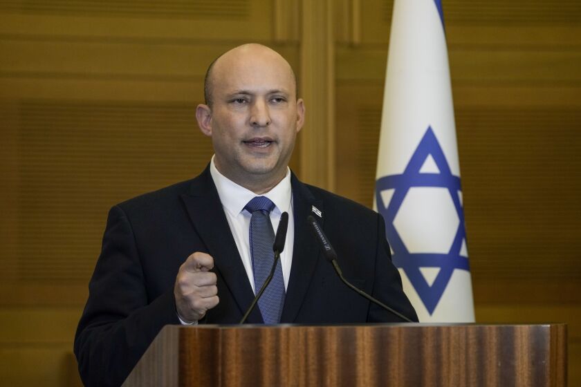 FILE - Israeli Prime Minister Naftali Bennett delivers a statement at the Knesset, Israel's parliament, in Jerusalem on June 29, 2022. Bennett, a former Israeli prime minister who served briefly as a mediator at the start of Russia's war with Ukraine, said during an interview posted online Saturday, Feb. 4, 2023, he drew a promise from the Russian president not to kill his Ukrainian counterpart. (AP Photo/Tsafrir Abayov, File)