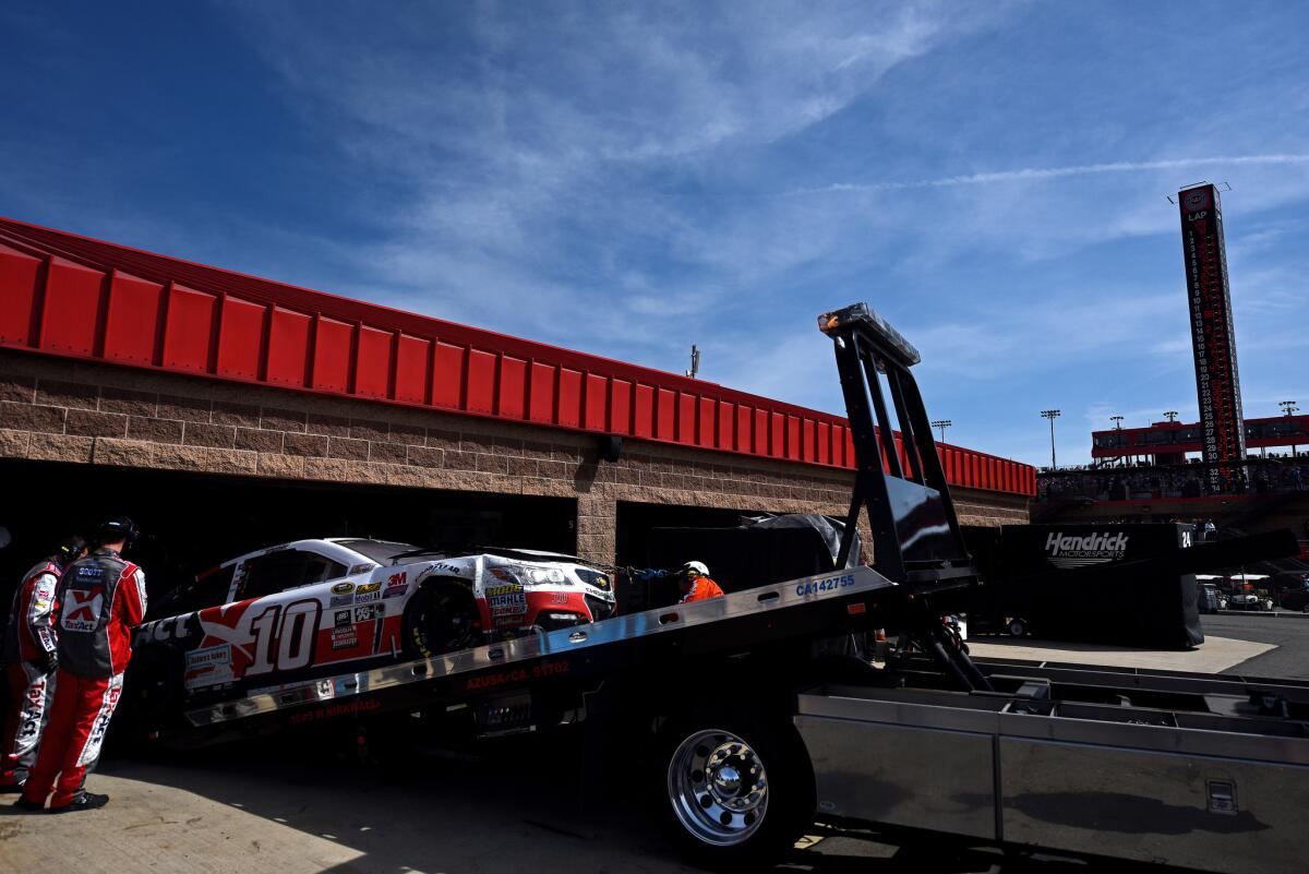 The #10 TaxACT Chevrolet, driven by Danica Patrick (not pictured), is towed to the garage after being involved in an on-track incident during the Auto Club 400 in Fontana.