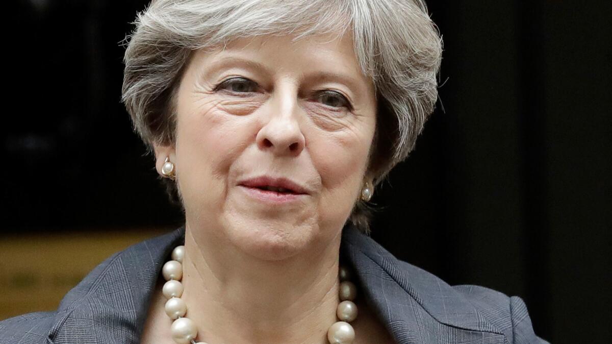 British Prime Minister Theresa May, shown Oct. 11, 2017, said that President Trump's retweets were wrong but that the invitation for him to pay a state visit to the United Kingdom stood.
