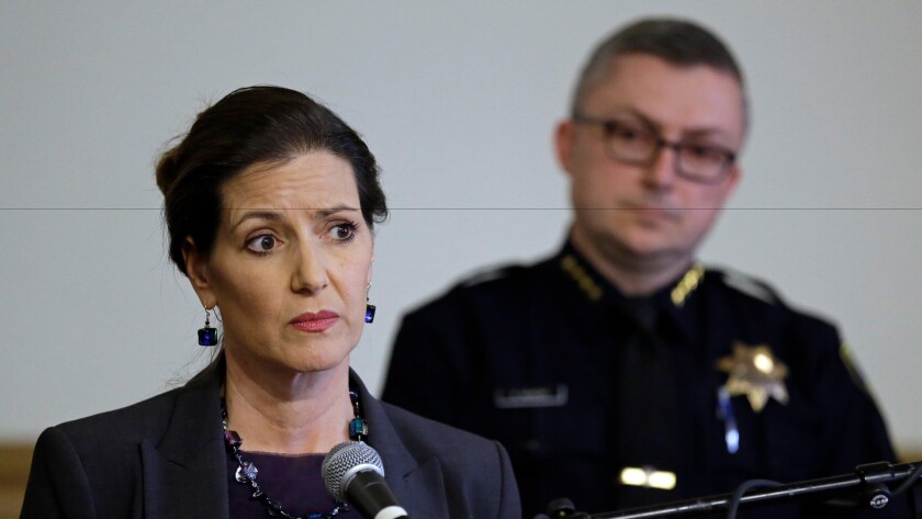 Oakland Mayor Libby Schaaf, left, speaks beside former Oakland Chief of Police Sean Whent. He abruptly resigned last week amid a sexual misconduct scandal in the police department.