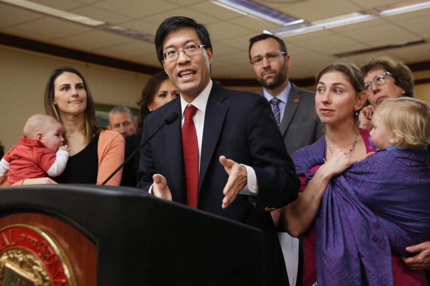 Sen. Richard Pan (D-Sacramento), accompanied by concerned mothers and their children, speaks in February on his vaccine bill.