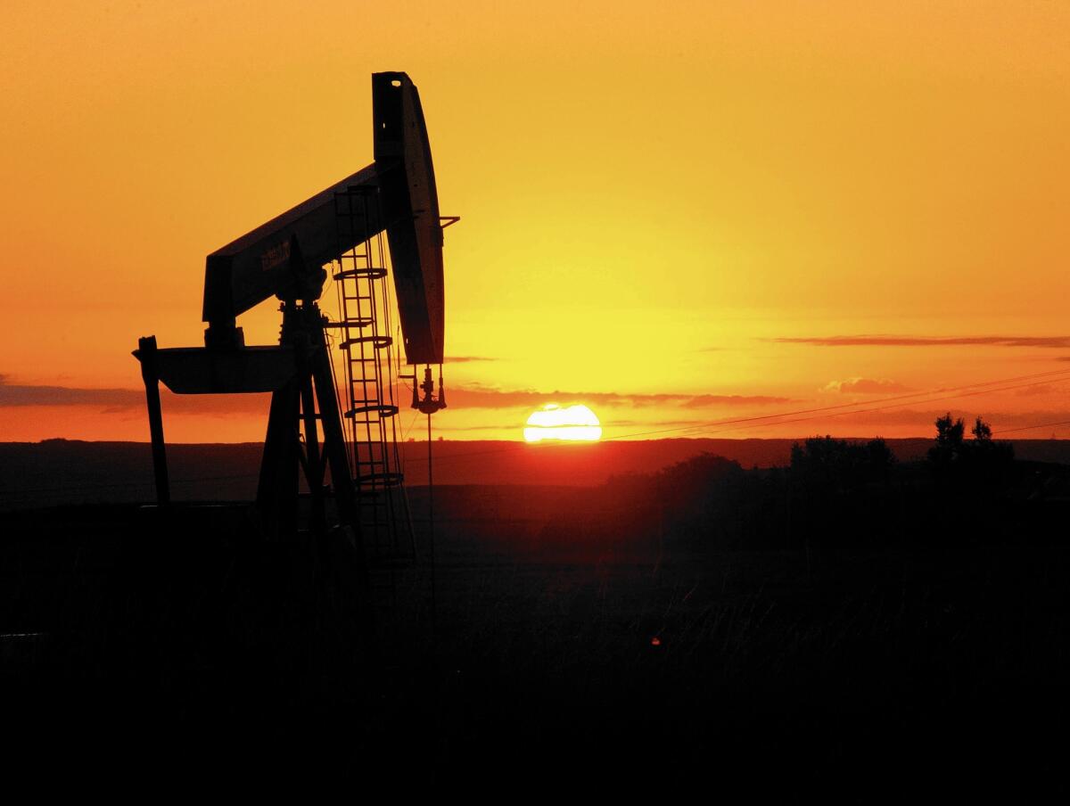 Uncertainty surrounding China’s slowdown has sent commodity prices spiraling down. Above, an oil well in North Dakota.