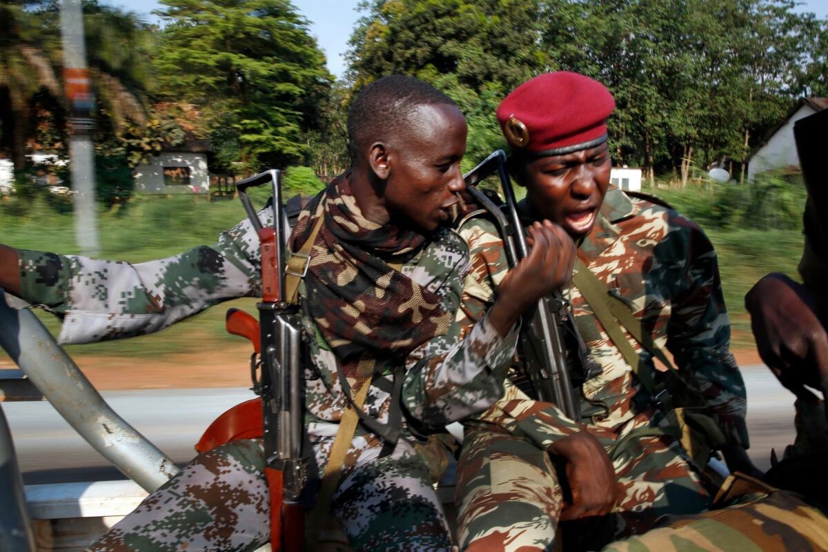 Ex-Seleka soldiers patrol in the Central African Republic capital of Bangui following a daylong battle with Christian militias.