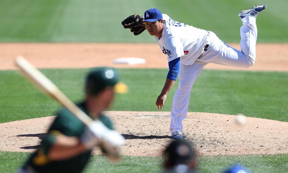 Dodgers starter Hyun-Jin Ryu delivers a pitch during a Cactus League game Monday against the Oakland Athletics.