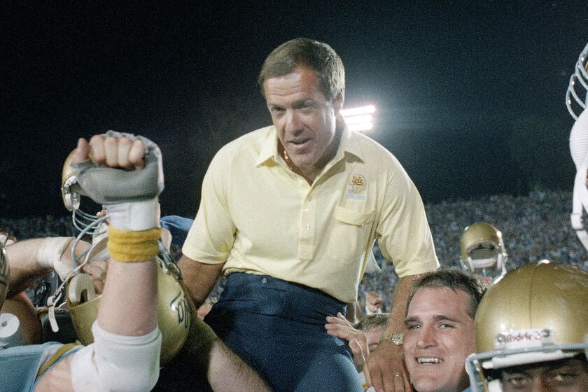 UCLA coach Terry Donahue is carried off the field by Bruin players after UCLA defeated Nebraska.