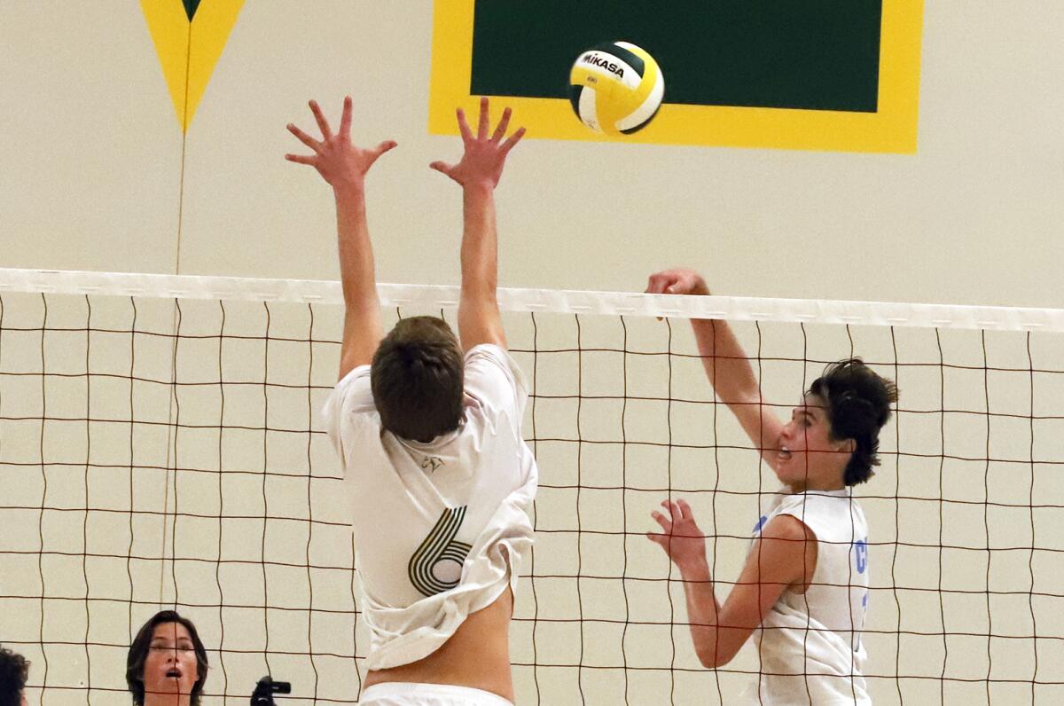 Corona del Mar's Sterling Foley (11) taps the ball past Mira Costa's Stone Seligson (6).