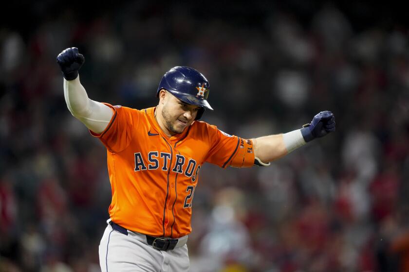 Houston Astros designated hitter Yainer Diaz celebrates after hitting a two-run home run to score Yordan Alvarez during the seventh inning of a baseball game against the Los Angeles Angels, Friday, June 7, 2024, in Anaheim, Calif. (AP Photo/Ryan Sun)
