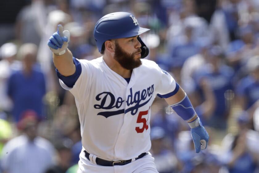 LOS ANGELES, CA -- AUGUST 07, 2019: Dodgers Russell Martin knows his walkoff single in the ninth inning driving in two runs is enough to beat the Cardinals Wednesday. Dodgers won 2-1. (Myung J. Chun / Los Angeles Times)