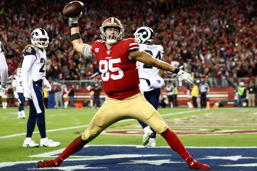 SANTA CLARA, CALIFORNIA - DECEMBER 21: Tight end George Kittle #85 of the San Francisco 49ers spikes the ball after his fourth quarter touchdown over the Los Angeles Rams at Levi's Stadium on December 21, 2019 in Santa Clara, California. (Photo by Ezra Shaw/Getty Images)