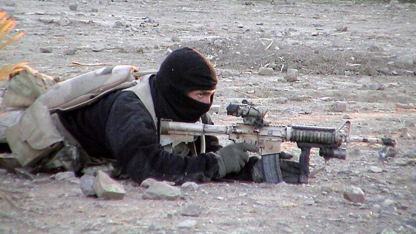 An undated photograph released on January 14, 2002, by the U.S. Department of Defense shows a U.S. Navy SEAL during an operation in Afghanistan.
