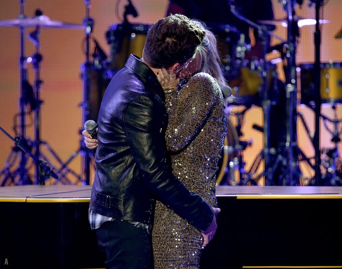 Singers Charlie Puth and Meghan Trainor smooch and generate some Web heat at the 2015 American Music Awards at Microsoft Theater.