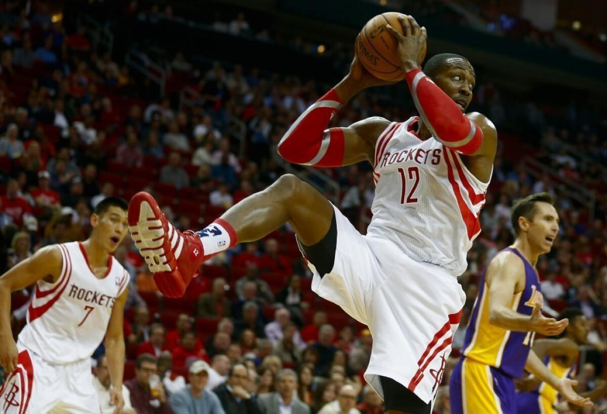Houston Rockets center Dwight Howard grabs a rebound against the Lakers on Thursday.