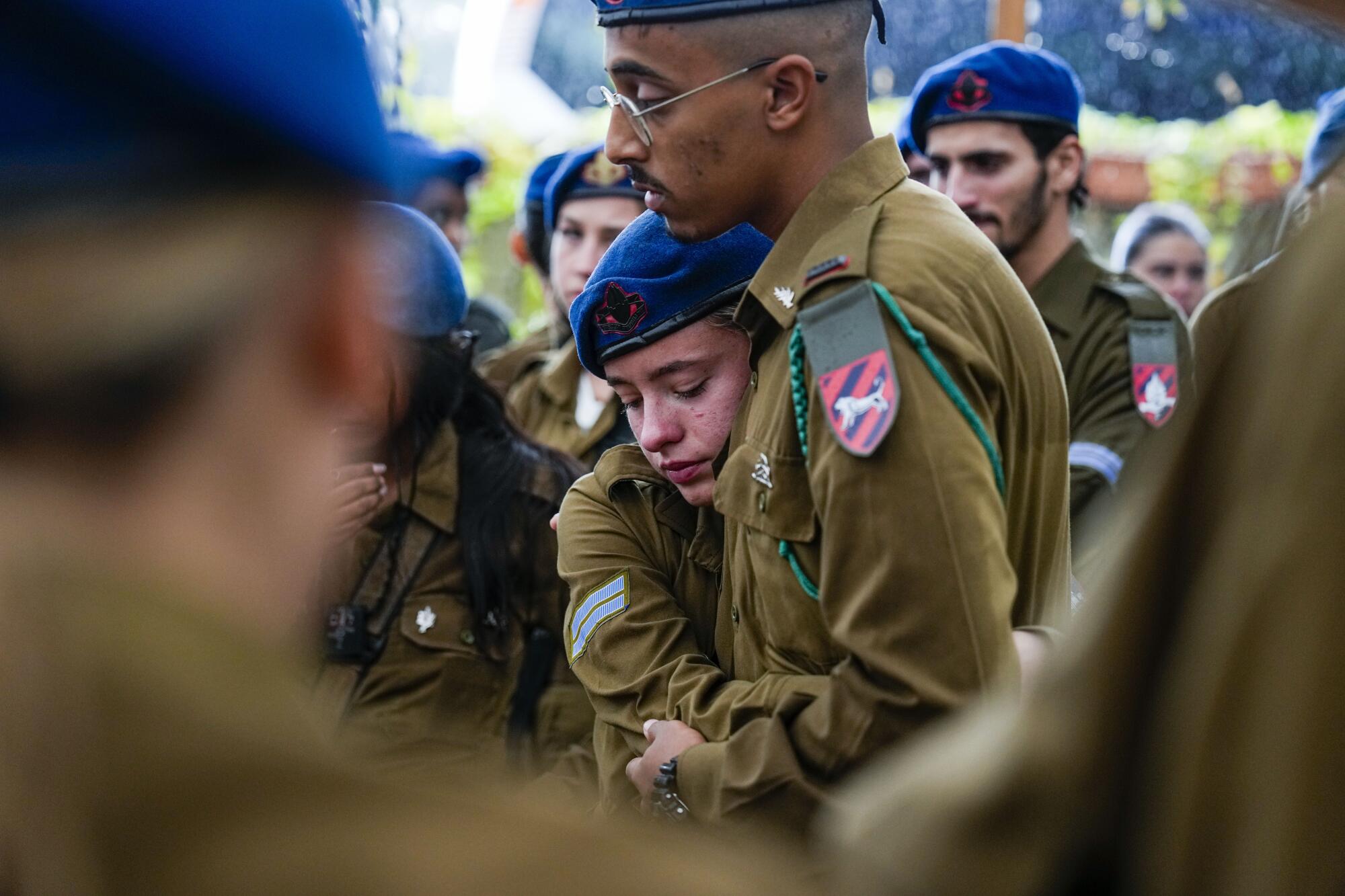 Israeli soldiers mourning at a funeral