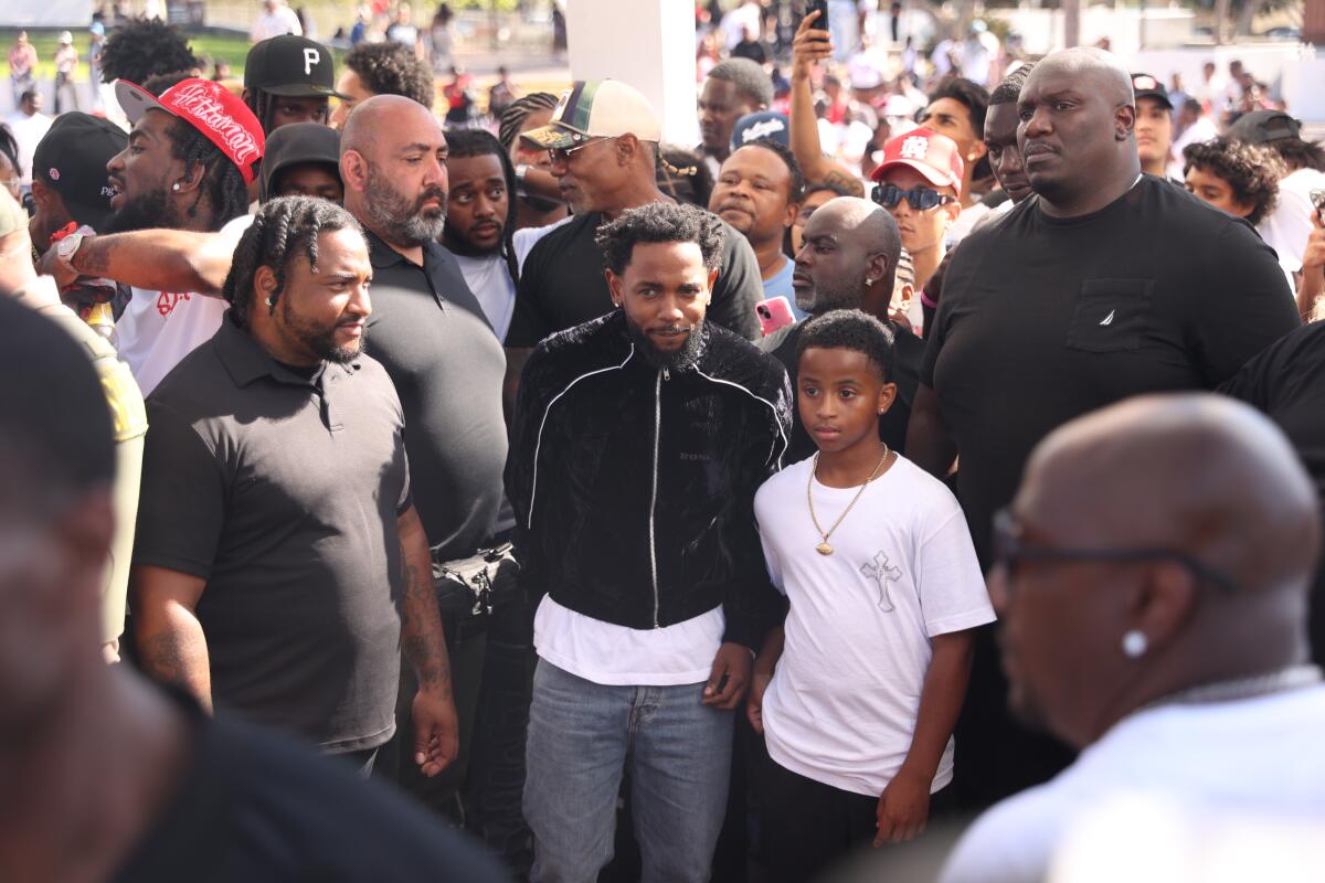 Kendrick Lamar prepares to perform during the music video shoot for "Not Like Us" at the Compton Courthouse.