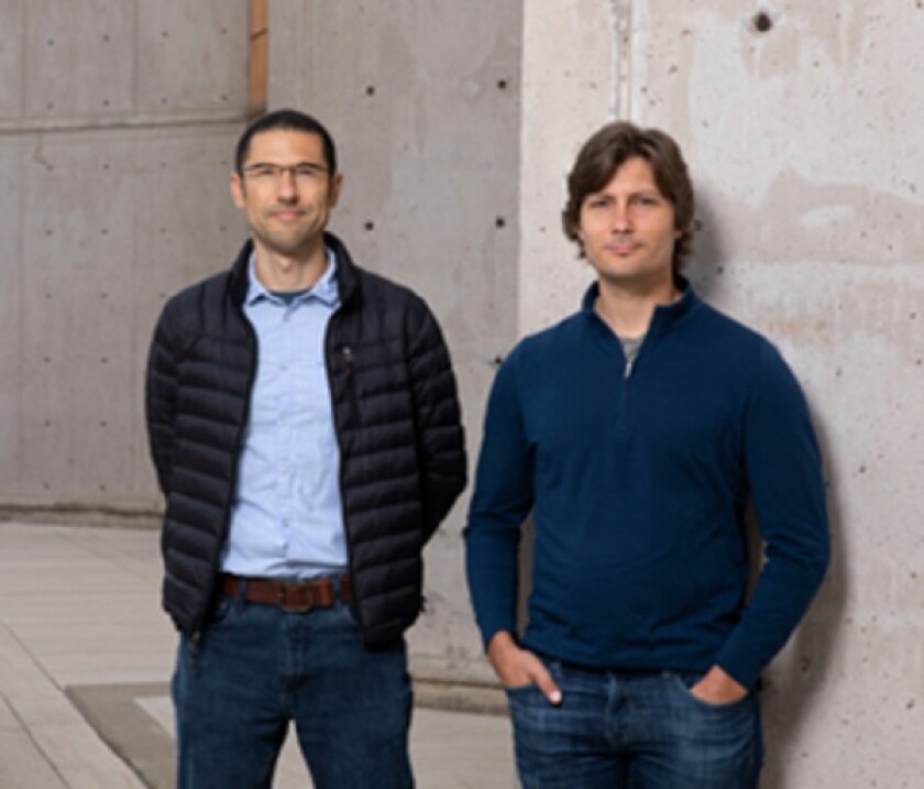 Dario Passos (left) and Dmitry Lyumkis are co-authors of a study on how HIV replicates within cells.