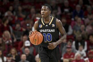 San Jose State guard Omari Moore (10) runs a play against Arkansas during an NCAA college basketball game Saturday, Dec. 3, 2022, in Fayetteville, Ark. (AP Photo/Michael Woods)